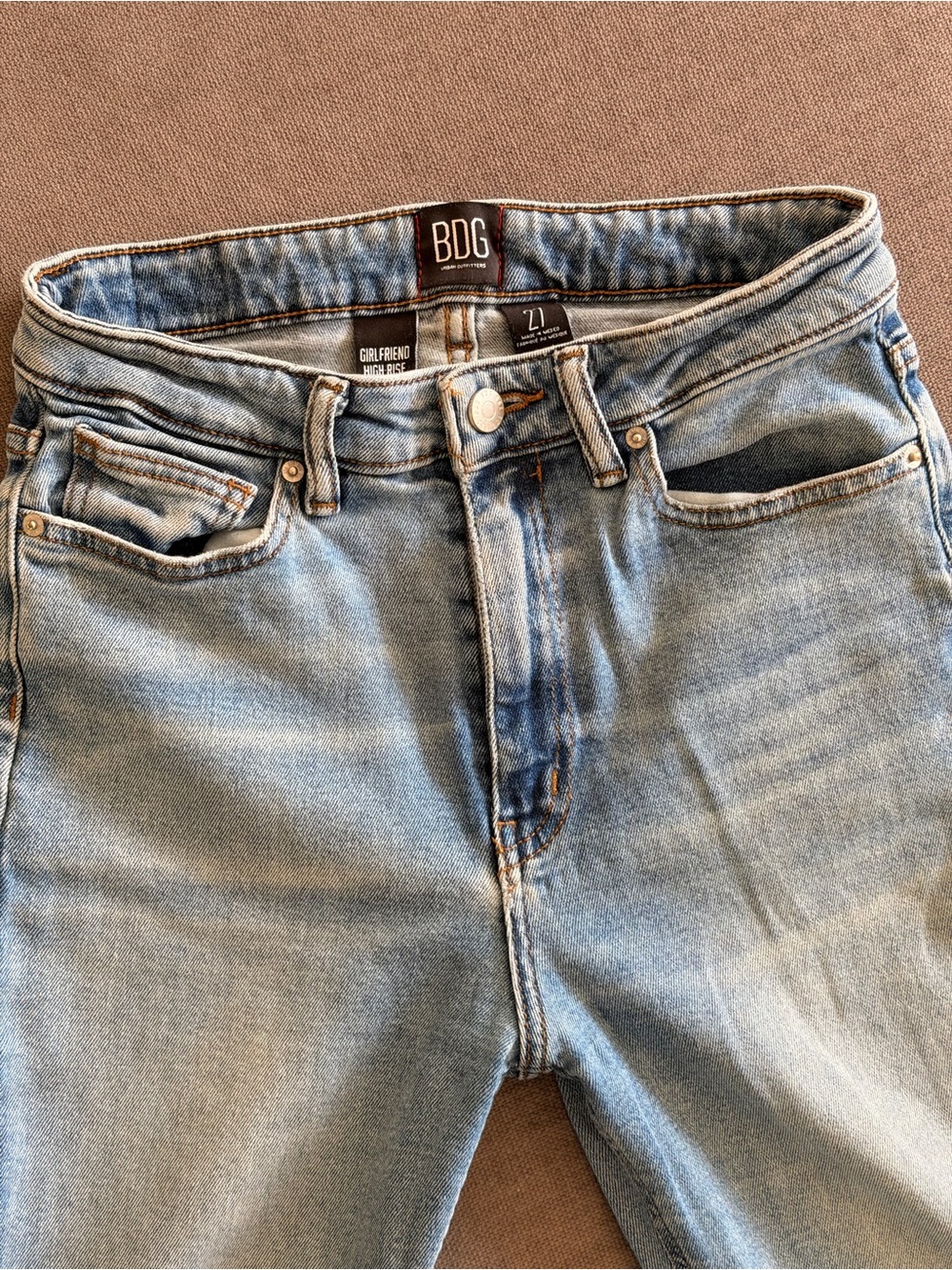 BDG Urban Outfitters Girlfriend High Rise jeans in a versatile light blue wash.